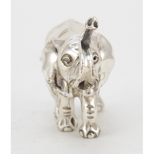 3727 - Miniature silver model of an elephant, hallmarked London 1942, 6cm in length, 52.0g