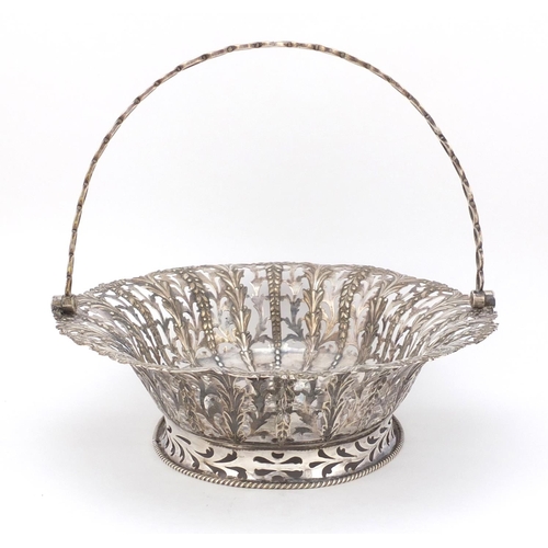 3015 - George II oval silver bread basket with swing handle, by John Langford II and John Sebille, the body... 