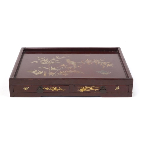 3953 - Chinese red lacquered desk stand with two drawers, gilded with bird and butterflies amongst flowers,... 