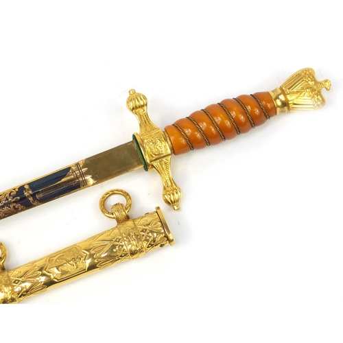 3110 - Good German military interest naval dagger with scabbard, the gilt blade finely engraved with a ship... 