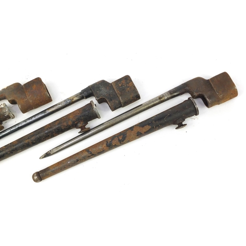 3116 - Three British military socket bayonets with scabbards, each 27.5cm in length