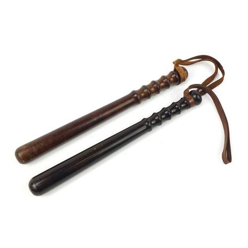 3906 - Two vintage turned wood police truncheons, the largest 39.5cm in length