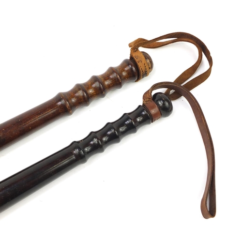 3906 - Two vintage turned wood police truncheons, the largest 39.5cm in length