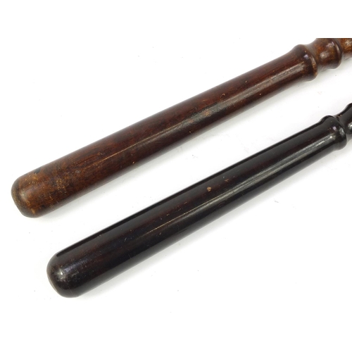 3906 - Two vintage turned wood police truncheons, the largest 39.5cm in length