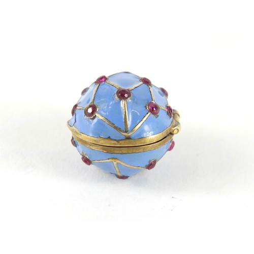 3374 - Russian silver gilt and enamel egg pendant, set with garnets, 2.6cm in length, 6.4g