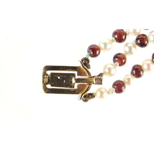 4016 - Three row garnet and pearl necklace with 9ct gold clasp, DHJ maker's mark, housed in a JB Yabsley bo... 