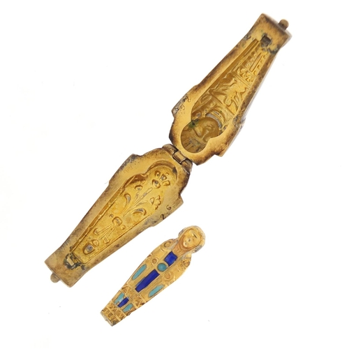 3477 - Egyptian Revival unmarked silver and enamel Tutankhamun pendant, opening to reveal an enamelled mumm... 