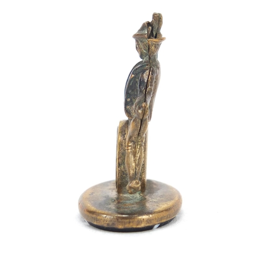 3863 - Gilt metal and agate compass fob in the form of a merry gentleman, 3cm high