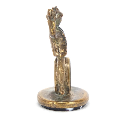 3863 - Gilt metal and agate compass fob in the form of a merry gentleman, 3cm high