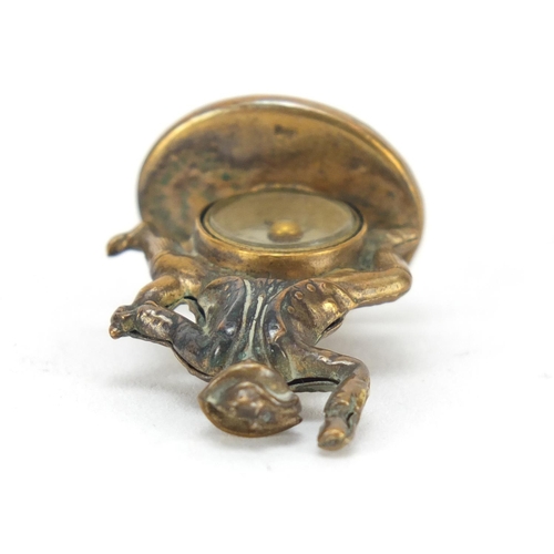 3863 - Gilt metal and agate compass fob in the form of a merry gentleman, 3cm high