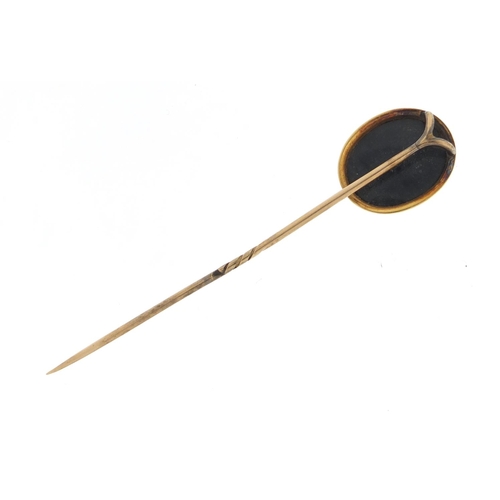 3104 - Victorian unmarked gold cameo glass tie pin, 8cm in length, housed in a velvet and silk lined tooled... 