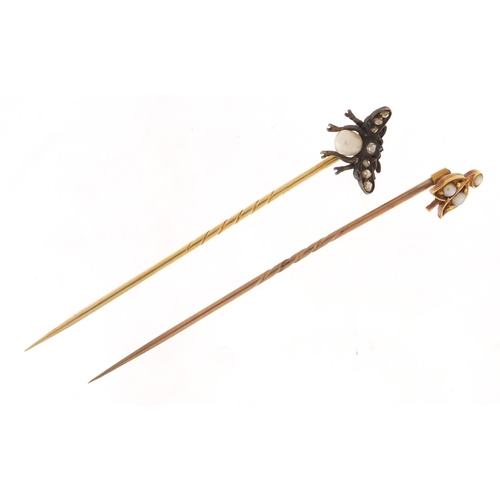 3600 - Two Victorian unmarked gold tie pins including a fly with pearl body and set with diamonds, each hou... 