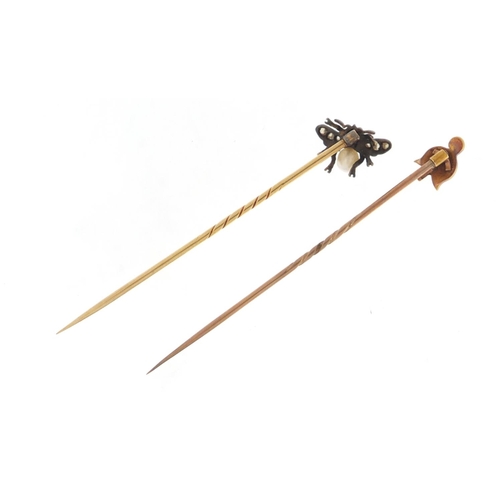 3600 - Two Victorian unmarked gold tie pins including a fly with pearl body and set with diamonds, each hou... 