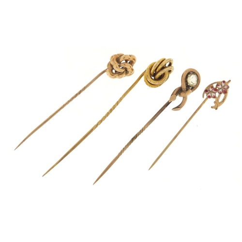 3225 - Three Victorian unmarked gold tie pins and one other enamelled with flowers, the largest 7cm in leng... 