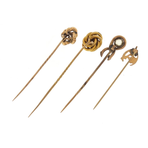 3225 - Three Victorian unmarked gold tie pins and one other enamelled with flowers, the largest 7cm in leng... 