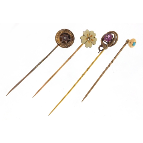 3666 - Four Victorian unmarked gold and gilt metal tie pins including a serpent and one set with a diamond ... 