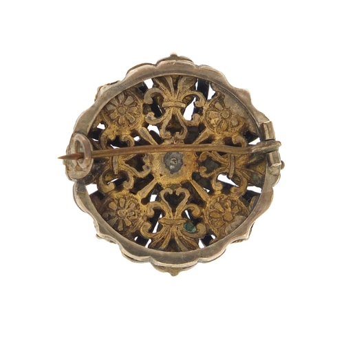 3762 - Antique unmarked white metal enamelled brooch, set with garnets and green stones, 2.6cm in diameter,... 