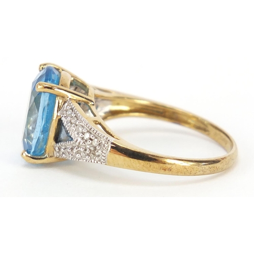 4128 - 9ct gold blue topaz and diamond ring, size P, 3.7g