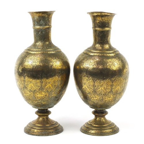 3847 - Large pair of Indian brass vases engraved with figures, animals and flowers, each 53cm high