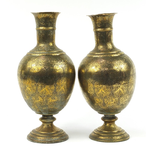 3847 - Large pair of Indian brass vases engraved with figures, animals and flowers, each 53cm high