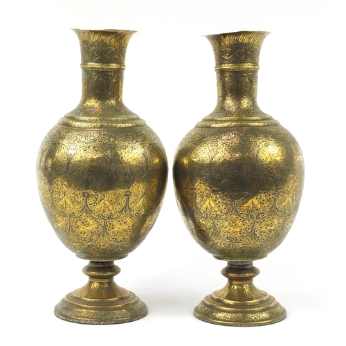 3847 - Large pair of Indian brass vases engraved with figures, animals and flowers, each 53cm high