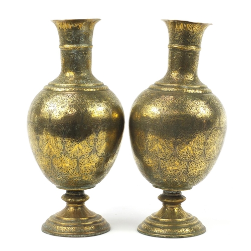 3847 - Large pair of Indian brass vases engraved with figures, animals and flowers, each 53cm high