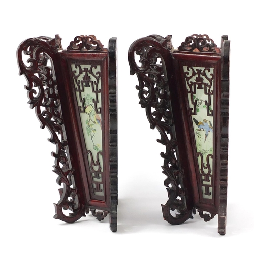 3947 - Pair of Chinese carved wood wall lights with panels, each decorated with birds, 33cm high