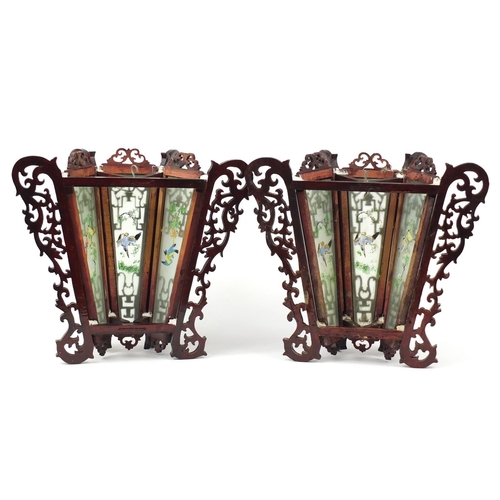 3947 - Pair of Chinese carved wood wall lights with panels, each decorated with birds, 33cm high