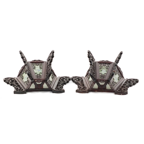 3947 - Pair of Chinese carved wood wall lights with panels, each decorated with birds, 33cm high