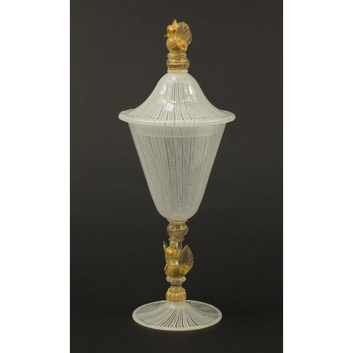 3258 - Large Venetian Latticino glass goblet with cover, having a gold flecked swan design stem and finial,... 