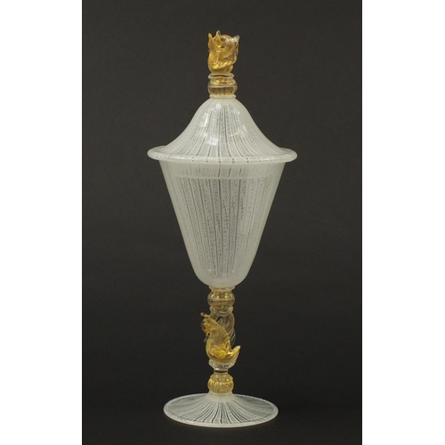 3258 - Large Venetian Latticino glass goblet with cover, having a gold flecked swan design stem and finial,... 