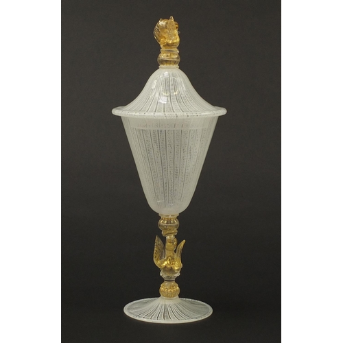 3258 - Large Venetian Latticino glass goblet with cover, having a gold flecked swan design stem and finial,... 