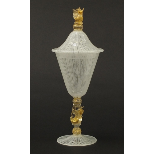 3258 - Large Venetian Latticino glass goblet with cover, having a gold flecked swan design stem and finial,... 