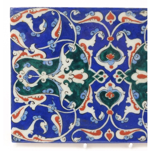 3134 - Rectangular Turkish Iznik tile fragment, hand painted with flowers, 24cm x 16.5cm