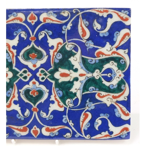 3134 - Rectangular Turkish Iznik tile fragment, hand painted with flowers, 24cm x 16.5cm