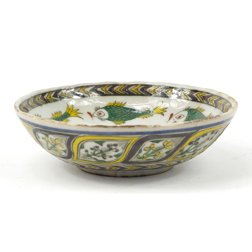 3827 - 18th century Turkish Kutahya pottery bowl hand painted with fish and flowers, 16.5cm in diameter