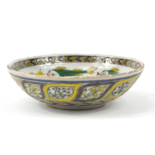 3827 - 18th century Turkish Kutahya pottery bowl hand painted with fish and flowers, 16.5cm in diameter