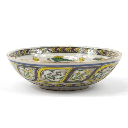 3827 - 18th century Turkish Kutahya pottery bowl hand painted with fish and flowers, 16.5cm in diameter