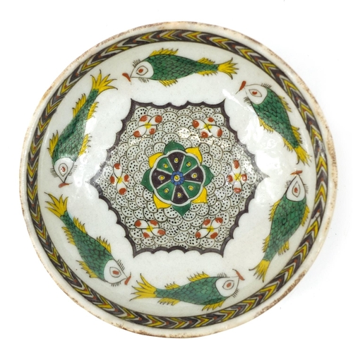 3827 - 18th century Turkish Kutahya pottery bowl hand painted with fish and flowers, 16.5cm in diameter