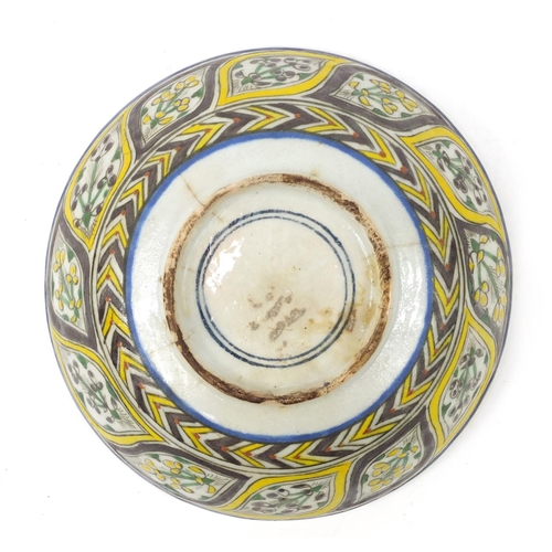 3827 - 18th century Turkish Kutahya pottery bowl hand painted with fish and flowers, 16.5cm in diameter