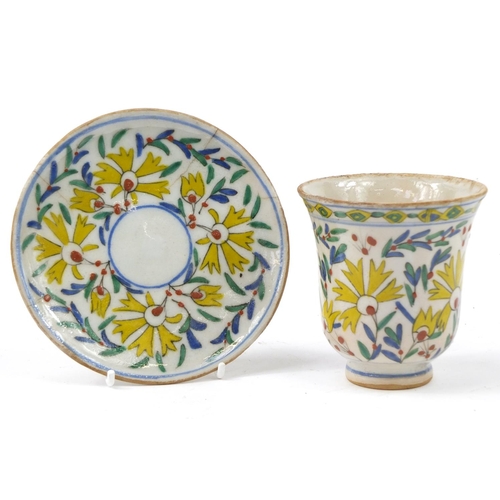 3826 - 18th century Turkish Kutahya pottery cup and saucer hand painted with flowers, the cup 10cm high, th... 