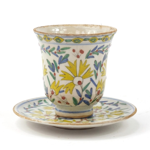 3826 - 18th century Turkish Kutahya pottery cup and saucer hand painted with flowers, the cup 10cm high, th... 