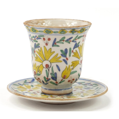 3826 - 18th century Turkish Kutahya pottery cup and saucer hand painted with flowers, the cup 10cm high, th... 