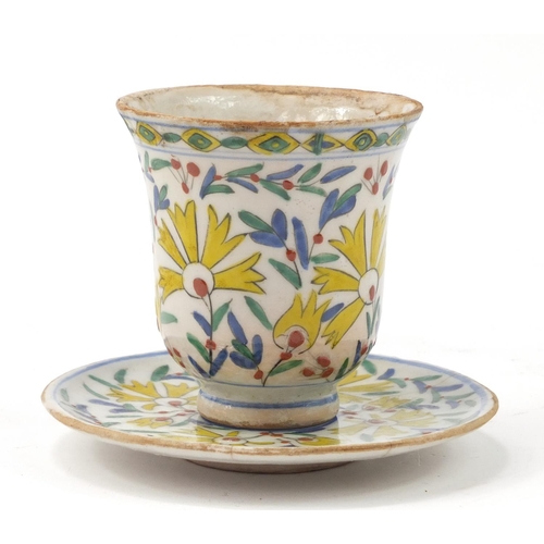 3826 - 18th century Turkish Kutahya pottery cup and saucer hand painted with flowers, the cup 10cm high, th... 