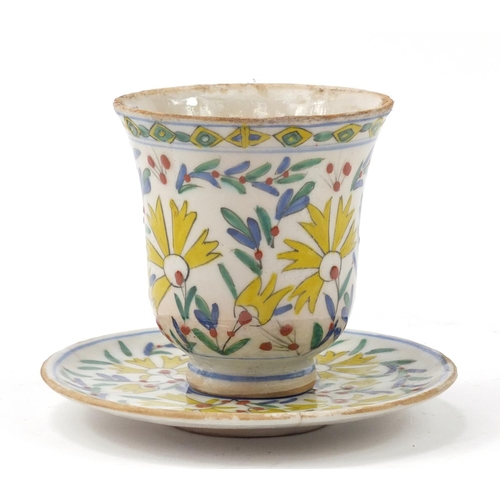 3826 - 18th century Turkish Kutahya pottery cup and saucer hand painted with flowers, the cup 10cm high, th... 