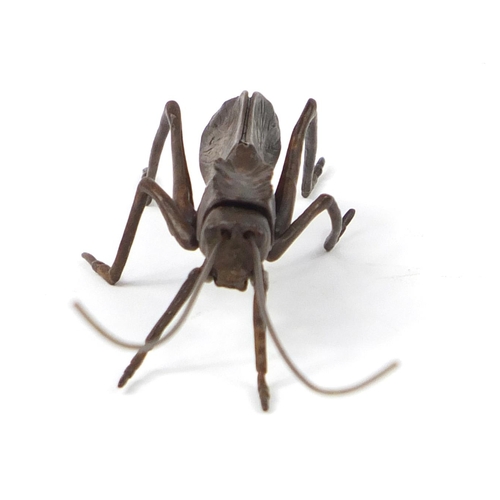 3798 - Japanese patinated bronze cricket with articulated antennae and legs, 14.5cm in length