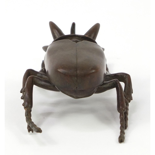 3388 - Large Japanese patinated bronze beetle with articulated wings, impressed character marks to the base... 