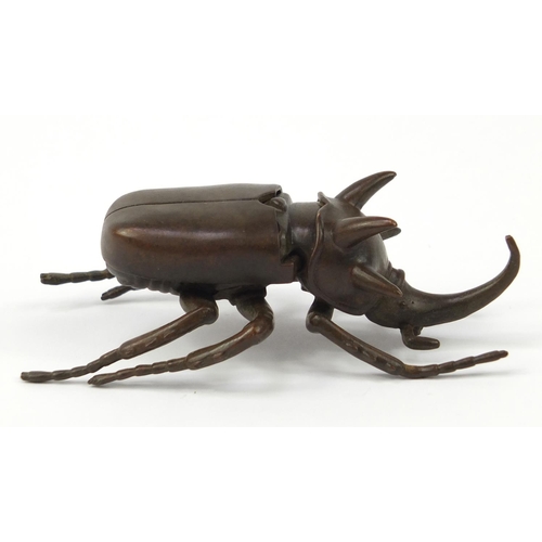 3388 - Large Japanese patinated bronze beetle with articulated wings, impressed character marks to the base... 