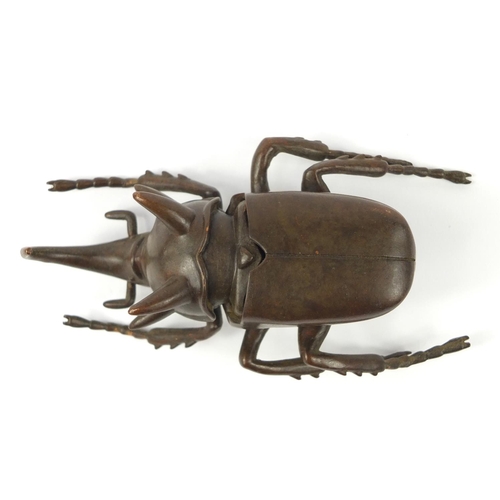 3388 - Large Japanese patinated bronze beetle with articulated wings, impressed character marks to the base... 