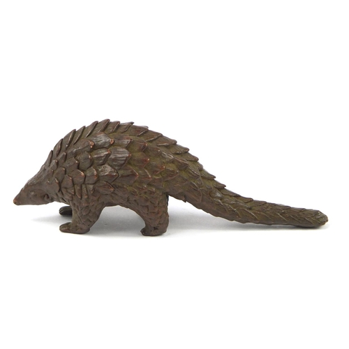 3799 - Japanese patinated bronze armadillo, impressed character marks to the base, 10.5cm in length